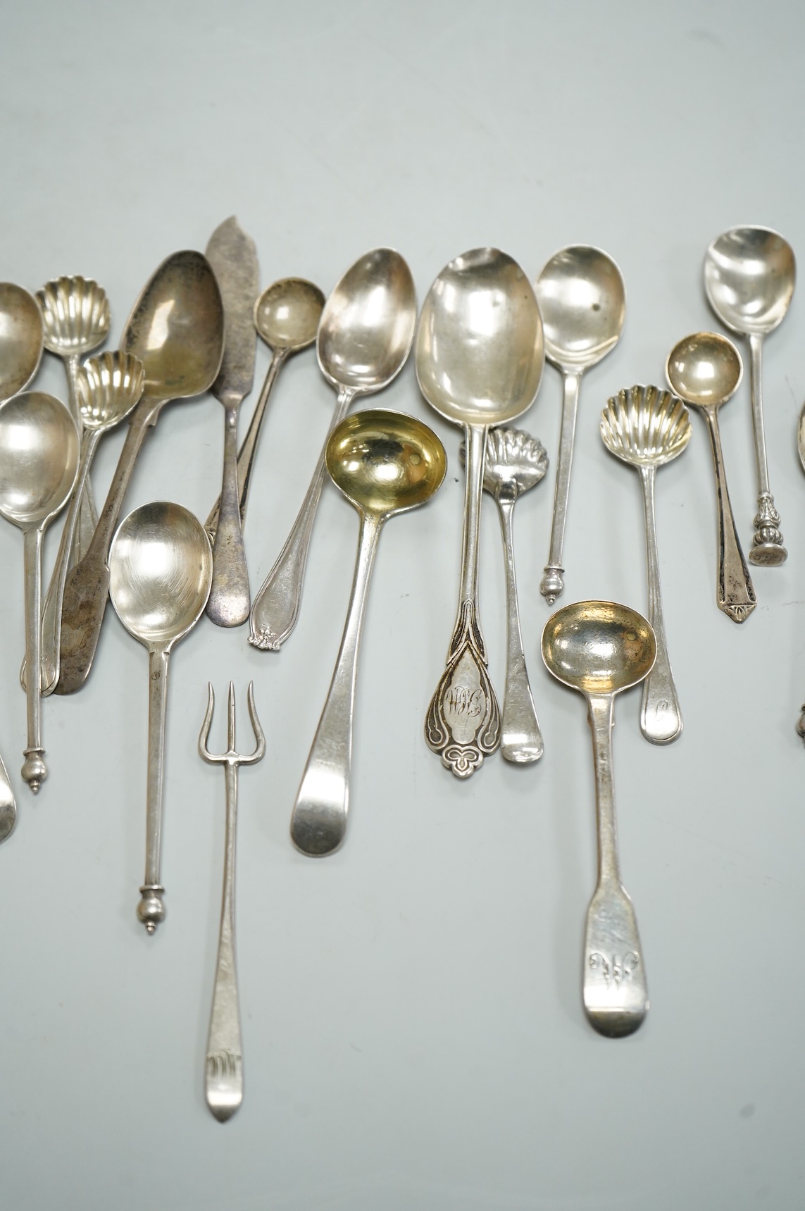 A collection of assorted 19th century and later silver flatware, including two George III table spoons, London, 1808 and 1804, various pattern, dates and makers, 13.1oz.